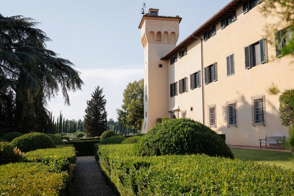 An Unforgettable Anniversary at Castello del Nero: A Three-Day Celebration in Tuscany 2 Tuscan villa with manicured gardens and cypress trees - Anniversary at Castello del Nero