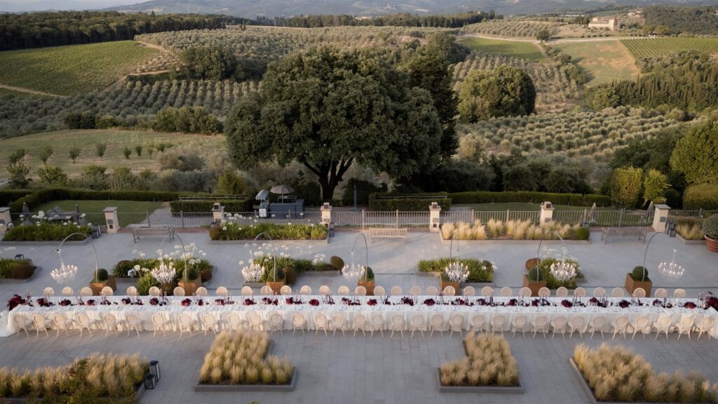 An Unforgettable Anniversary at Castello del Nero: A Three-Day Celebration in Tuscany 42 Elegant long table setting for an outdoor event in a Tuscan vineyard-. Anniversary at Castello del Nero - Italian Wedding Designer